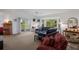 Bright living room with a sliding glass door and bay window at 401 N Bay Blvd, Anna Maria, FL 34216