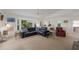 Spacious living room featuring a bay window, vaulted ceiling, and plush seating at 401 N Bay Blvd, Anna Maria, FL 34216