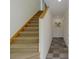 Carpeted staircase leading to the upper level of the home at 401 N Bay Blvd, Anna Maria, FL 34216