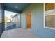 A balcony with grey composite floors overlooks another house at 4532 Chinkapin Dr, Sarasota, FL 34232