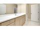 Bathroom with double sinks, white countertops, cabinets and marble floors at 4532 Chinkapin Dr, Sarasota, FL 34232