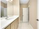 Bathroom featuring double sinks, white countertops, and marble floors at 4532 Chinkapin Dr, Sarasota, FL 34232