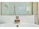 Modern bathtub featuring a waterfall faucet and sleek white tile, providing a spa-like experience at 4532 Chinkapin Dr, Sarasota, FL 34232