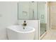 A serene bathroom features a soaking tub and a glass shower at 4532 Chinkapin Dr, Sarasota, FL 34232