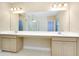 Spacious bathroom features double vanity and countertop, large mirror, and tiled floors at 4532 Chinkapin Dr, Sarasota, FL 34232