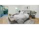 Bedroom features light grey decor and door to balcony at 4532 Chinkapin Dr, Sarasota, FL 34232