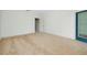 A bedroom with a door to the outside, bright walls, and beige carpets at 4532 Chinkapin Dr, Sarasota, FL 34232