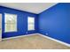 Bedroom with neutral carpet and walls painted vibrant blue at 4532 Chinkapin Dr, Sarasota, FL 34232