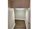 View of a walk-in closet featuring tile flooring and a built-in light fixture at 4532 Chinkapin Dr, Sarasota, FL 34232