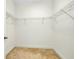 Walk-in closet with neutral carpet, ready for organizing, showcasing storage space at 4532 Chinkapin Dr, Sarasota, FL 34232