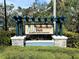 Hammock Park entrance sign amidst lush greenery at 4532 Chinkapin Dr, Sarasota, FL 34232