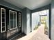 Exterior view of a charming entrance with a black door and brick-paved walkway at 4532 Chinkapin Dr, Sarasota, FL 34232