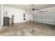 Spacious garage with concrete floor and gray garage door at 4532 Chinkapin Dr, Sarasota, FL 34232
