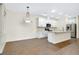 Bright, open floor plan featuring a modern kitchen with white cabinets and a kitchen island at 4532 Chinkapin Dr, Sarasota, FL 34232