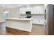 Modern kitchen with white cabinetry, stainless steel appliances, and island with breakfast bar at 4532 Chinkapin Dr, Sarasota, FL 34232