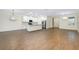 Open-concept kitchen and living area with tile flooring and modern lighting fixtures at 4532 Chinkapin Dr, Sarasota, FL 34232