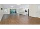 Bright, open living space featuring tile flooring, a large sliding door, and a modern, open-concept design at 4532 Chinkapin Dr, Sarasota, FL 34232