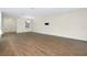 Open living room featuring wood-look tile flooring and neutral color palette, great for entertaining at 4532 Chinkapin Dr, Sarasota, FL 34232