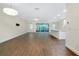 Spacious open floorplan with wood-look tile floors, ample light, and access to the outdoor patio at 4532 Chinkapin Dr, Sarasota, FL 34232