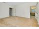 Spacious main bedroom with beige carpet leading to the bath and closet at 4532 Chinkapin Dr, Sarasota, FL 34232