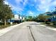 Neighborhood street featuring blue townhomes and well-maintained landscaping at 4532 Chinkapin Dr, Sarasota, FL 34232