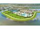 Aerial view shows the community recreational area featuring pools, clubhouse, and tennis courts at 4915 Kiva Cir, Bradenton, FL 34211