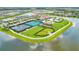 Aerial view of the community recreational area featuring pools, tennis courts and a lake at 4915 Kiva Cir, Bradenton, FL 34211