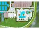 Overhead shot of the community pool with lounging area, clubhouse, tennis and bocce ball courts at 4915 Kiva Cir, Bradenton, FL 34211