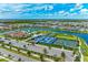Community aerial view featuring a pool, tennis courts, pickleball courts, lake, and clubhouse at 4915 Kiva Cir, Bradenton, FL 34211