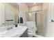 Contemporary bathroom with a marble countertop vanity and a glass-enclosed shower at 4915 Kiva Cir, Bradenton, FL 34211