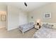 Shared bedroom featuring two twin beds, soft carpet, and natural light at 4915 Kiva Cir, Bradenton, FL 34211