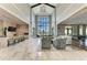 Open clubhouse interior showcasing high ceilings, marble floors, and comfortable seating areas at 4915 Kiva Cir, Bradenton, FL 34211