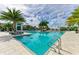 Inviting community pool area with a variety of seating options and shaded cabanas at 4915 Kiva Cir, Bradenton, FL 34211