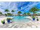 Stunning community pool with palm trees, ample seating, and resort-style amenities at 4915 Kiva Cir, Bradenton, FL 34211