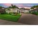 Charming home with meticulously landscaped front yard, brick driveway, and a two car garage at 4915 Kiva Cir, Bradenton, FL 34211