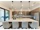 Modern kitchen with a large island, stainless steel appliances, and pendant lighting at 4915 Kiva Cir, Bradenton, FL 34211