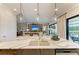 Modern kitchen featuring a large island with pendant lighting and stylish countertops, perfect for entertaining at 4915 Kiva Cir, Bradenton, FL 34211