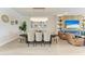 Bright and airy living room with a fireplace, and an open dining room at 4915 Kiva Cir, Bradenton, FL 34211