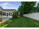 Backyard with well-manicured lawn, and a white fence at 5206 19Th W Ave, Bradenton, FL 34209