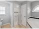 Bathroom featuring a shower, tub, and toilet with consistent design elements at 5206 19Th W Ave, Bradenton, FL 34209