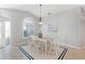 Bright dining room featuring a vaulted ceiling, large window, and stylish chandelier at 5206 19Th W Ave, Bradenton, FL 34209