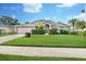 Charming single story home with lush lawn, mature landscaping, brick driveway, and attached two car garage at 5206 19Th W Ave, Bradenton, FL 34209
