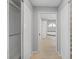 Hallway view with closet and leading to the bathroom with the tub visible at 5206 19Th W Ave, Bradenton, FL 34209