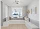 Cozy sitting area with built-in seating and decorative pillows offers a relaxing space at 5206 19Th W Ave, Bradenton, FL 34209