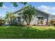 Charming home with manicured lawn, mature plantings, and a well maintained exterior at 5206 19Th W Ave, Bradenton, FL 34209