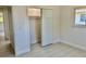 Bright bedroom with tiled floors, a closet and a window overlooking the side yard at 544 Mount Vernon Dr, Venice, FL 34293