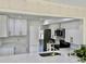 Modern kitchen featuring white cabinets, stainless steel appliances, quartz countertops, and a gold faucet at 544 Mount Vernon Dr, Venice, FL 34293