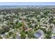 An aerial view showcases the surrounding community with its tree-lined streets and nearby waterfront at 5702 Tangerine S Ave, Gulfport, FL 33707