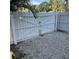 View of the backyard area with a gate and gravel base at 5702 Tangerine S Ave, Gulfport, FL 33707