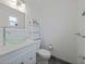 Bathroom features a decorative glass bowl sink and white cabinets at 5702 Tangerine S Ave, Gulfport, FL 33707